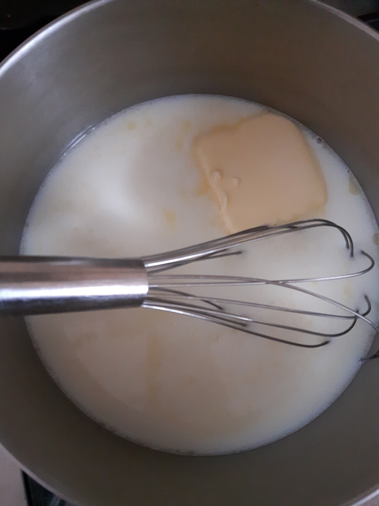 Whisk milk, granulated sugar and butter over heat