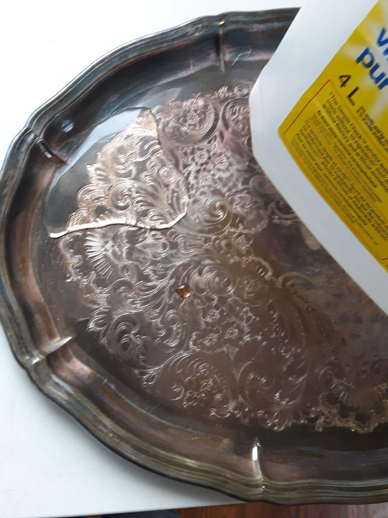 I tested a puddle of white vinegar on a tarnished platter and found only a small improvement