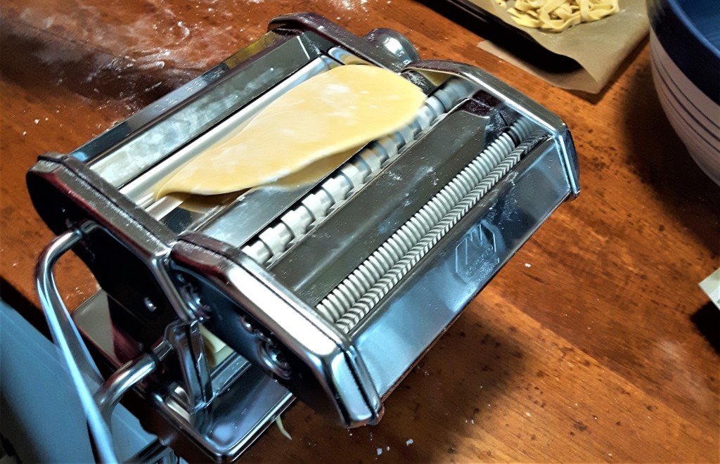 Feeding the dough into the pasta maker